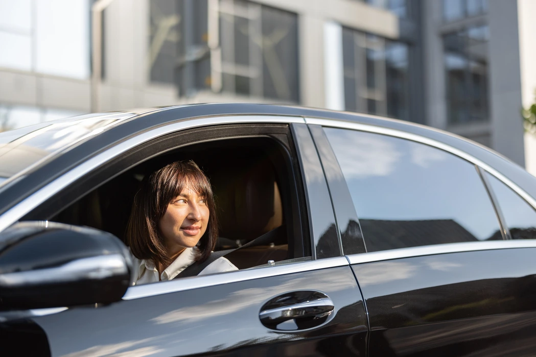 portrait-of-business-woman-in-luxury-car-2023-11-27-05-08-44-utc